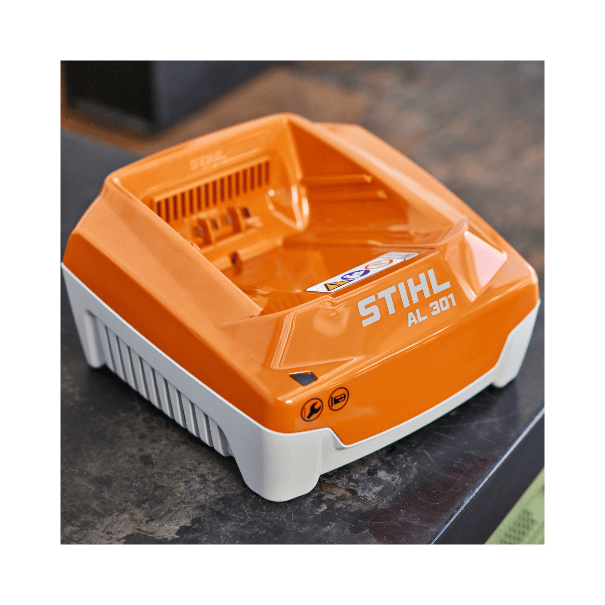 Stihl AL 301 battery charger on a dark surface