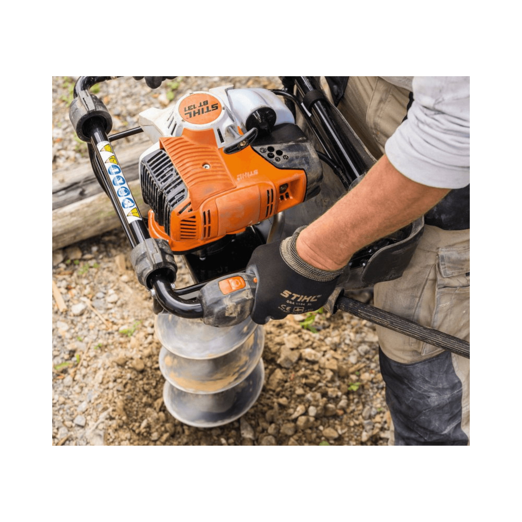 User operating the BT 131 Petrol Earth Auger for effective drilling in soil.