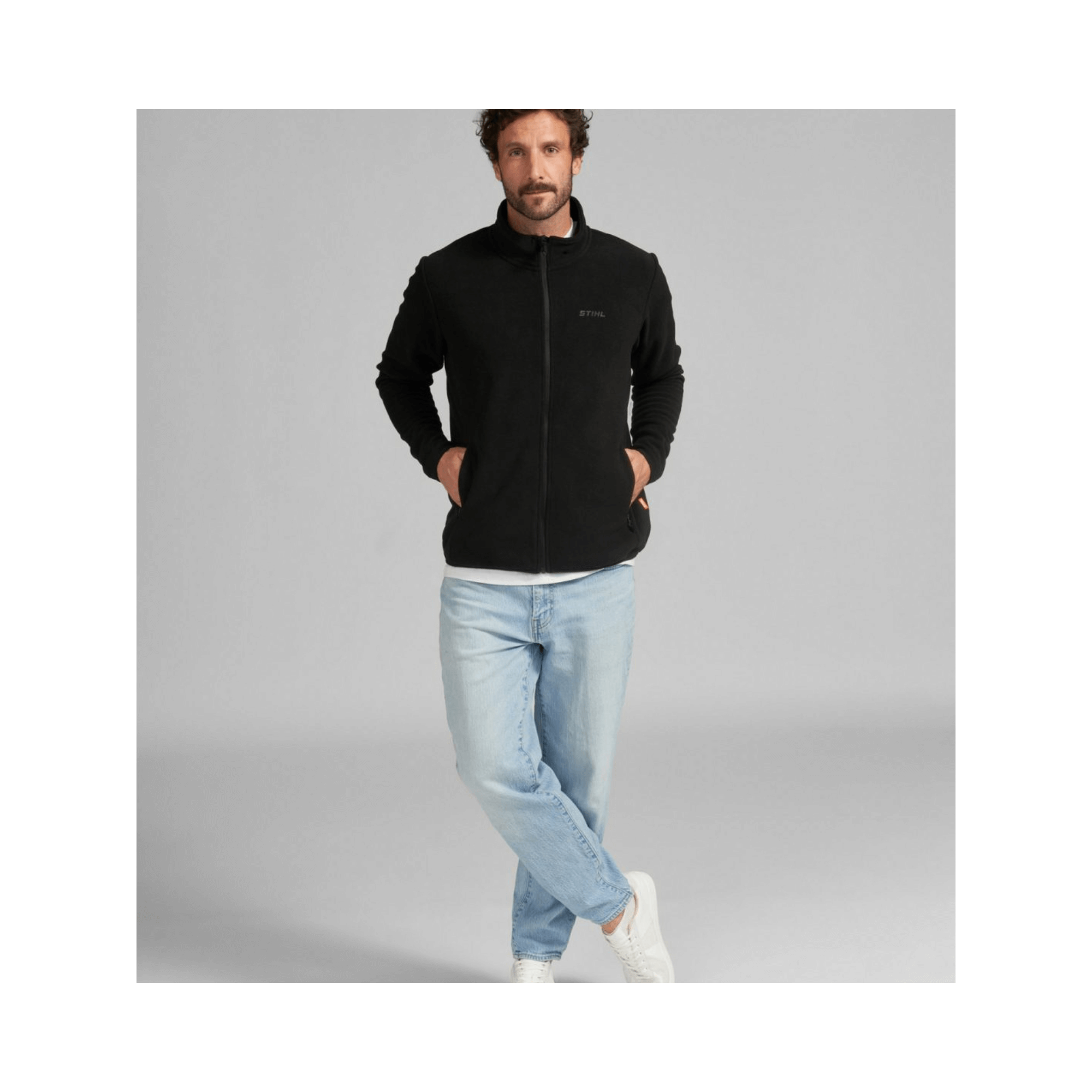 Black Fleece Jacket worn by a man, ideal for tree surgeons and outdoor activities.
