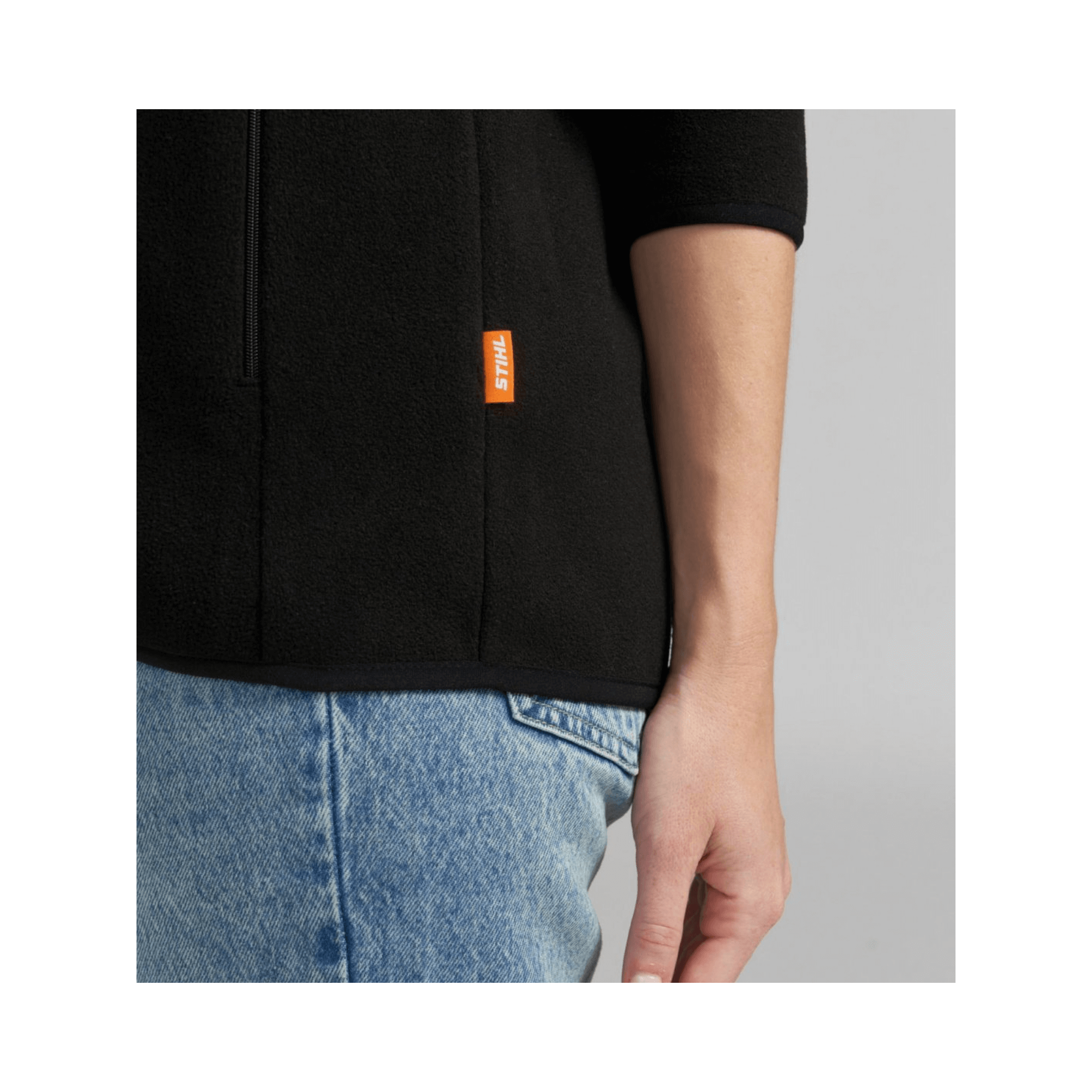 Detail of Black Fleece Jacket showing STIHL branding on sleeve, perfect for tree surgeons.
