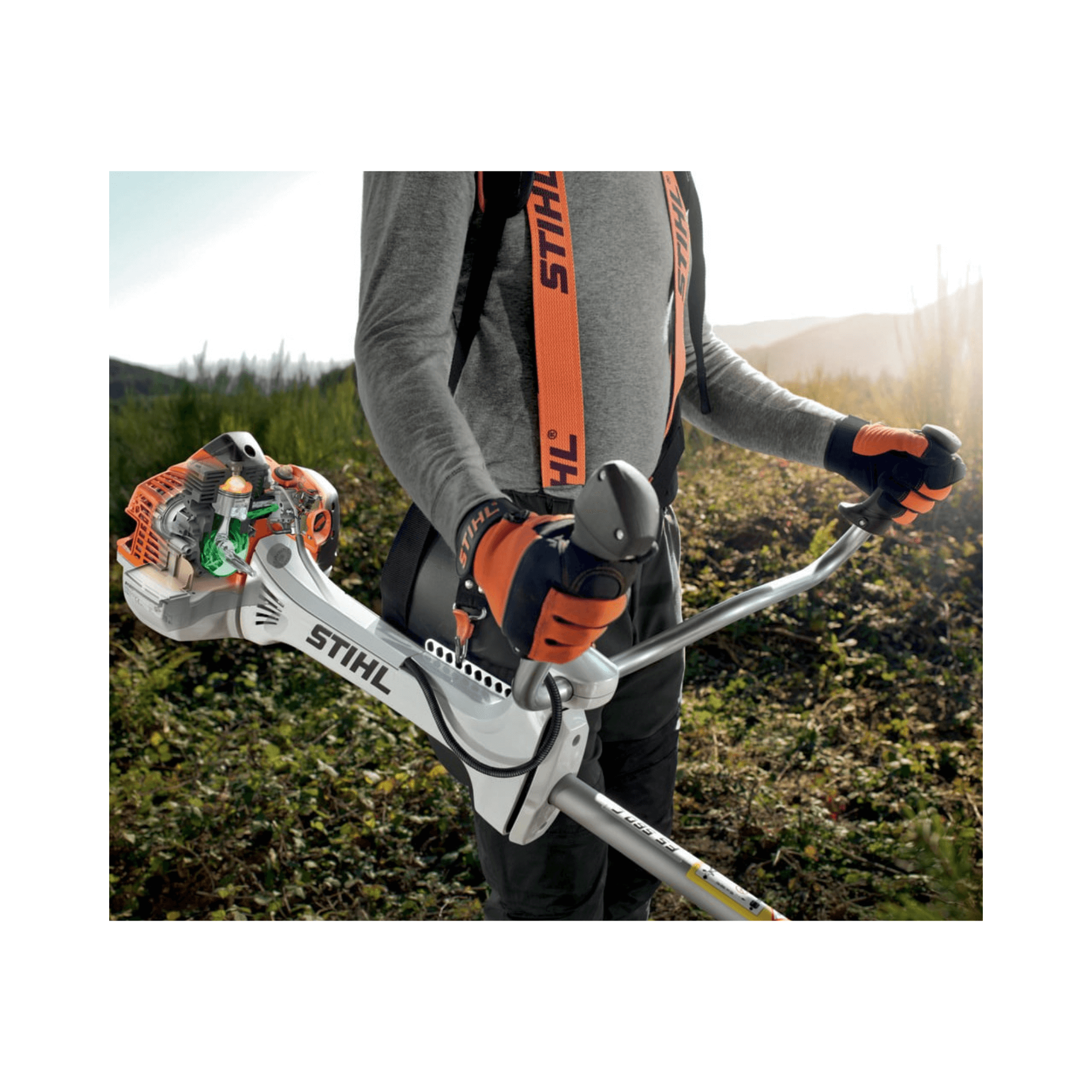 STIHL FS 491 C-EM petrol clearing saw held by an operator in a landscape, showcasing its ergonomic design and power.