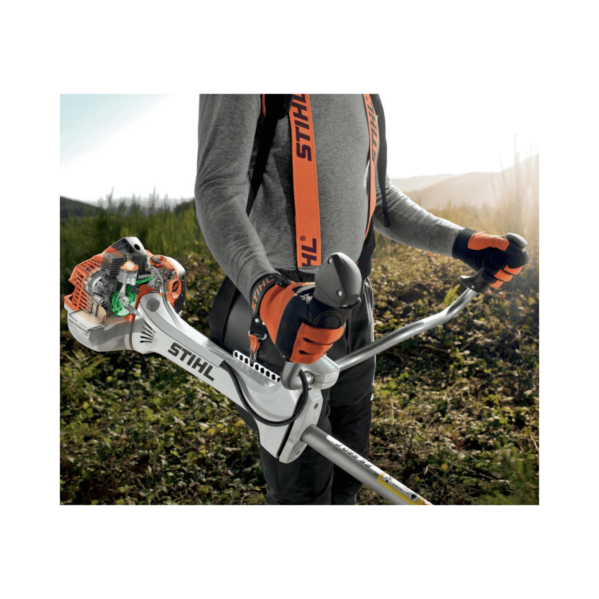 STIHL FS 491 C-EM petrol clearing saw held by an operator in a landscape, showcasing its ergonomic design and power.