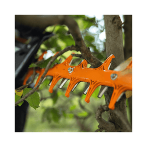 HSA 130 T Cordless Hedge Trimmer blade showcasing precision cutting in a garden setting.