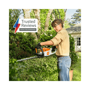 Person using HSA 60 Cordless Hedge Trimmer 24" on hedge, trusted reviews sticker highly recommended.