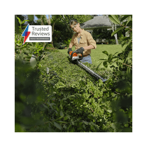 HSA 60 Cordless Hedge Trimmer 24" being used by a homeowner to trim a hedge in a garden setting.