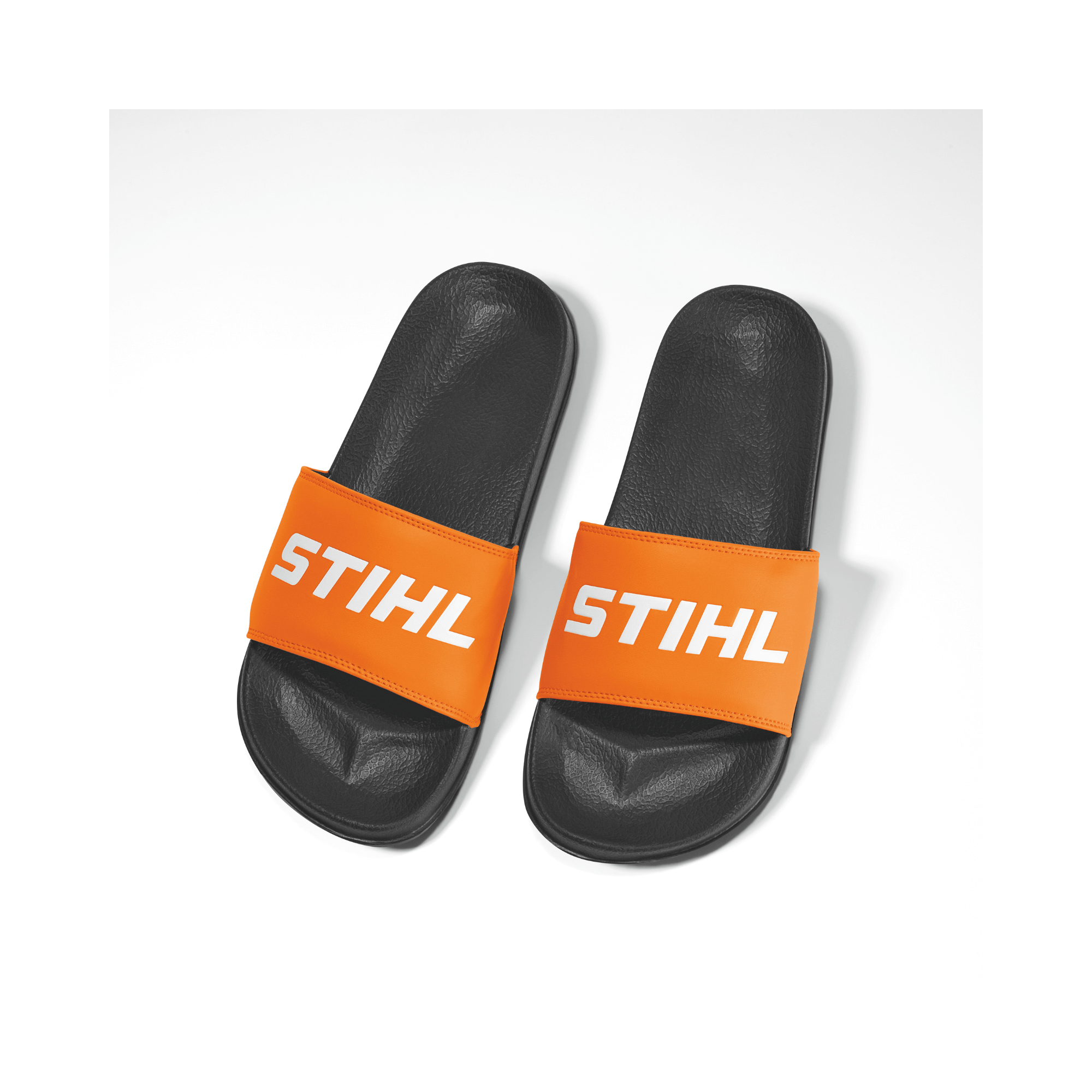 Pool Sliders featuring the STIHL logo in black and orange, perfect for tree surgeons and casual wear.