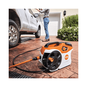 STAHL REA 60 PLUS Cordless Pressure Washer in use for efficient car cleaning with high-pressure hose.
