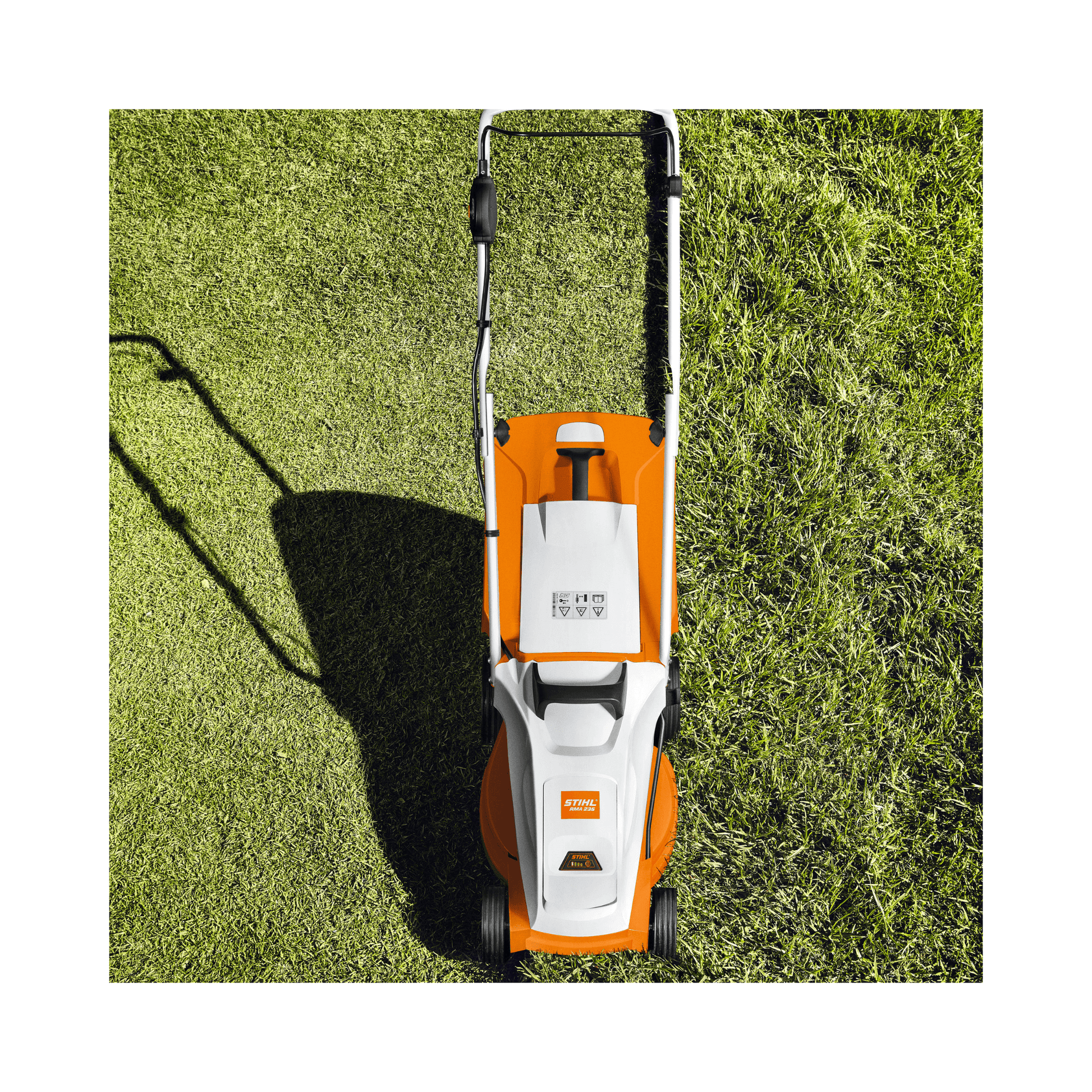 RMA 235 Cordless Lawnmower on grass, showcasing its lightweight and compact design for easy maneuverability.