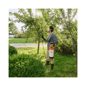 Person using the SGA 30 Cordless Backpack Sprayer AS Battery Set for plant care in a garden.