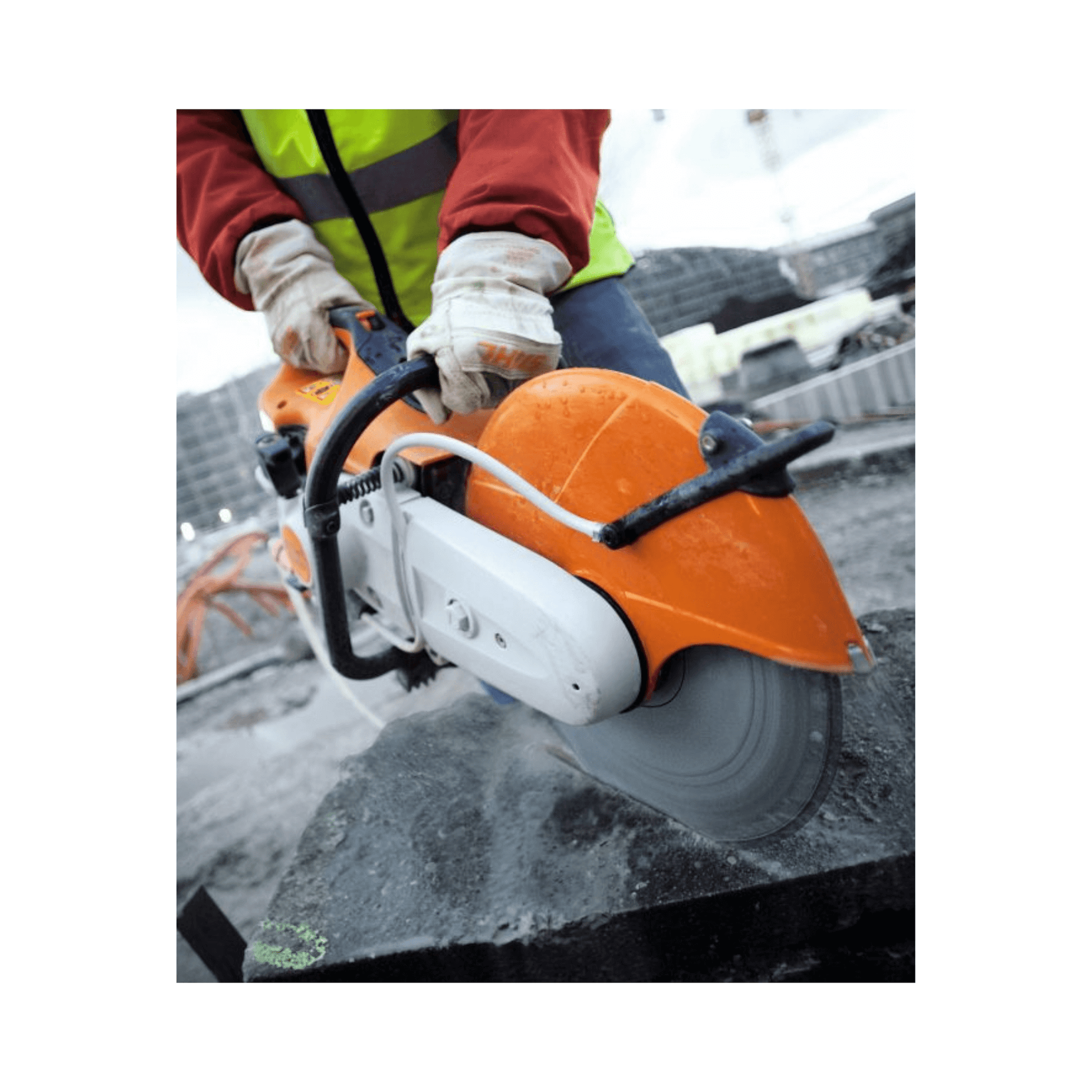 Person using the TS 480i Petrol Cut-Off Saw 12" on construction site, showcasing its powerful cutting performance.