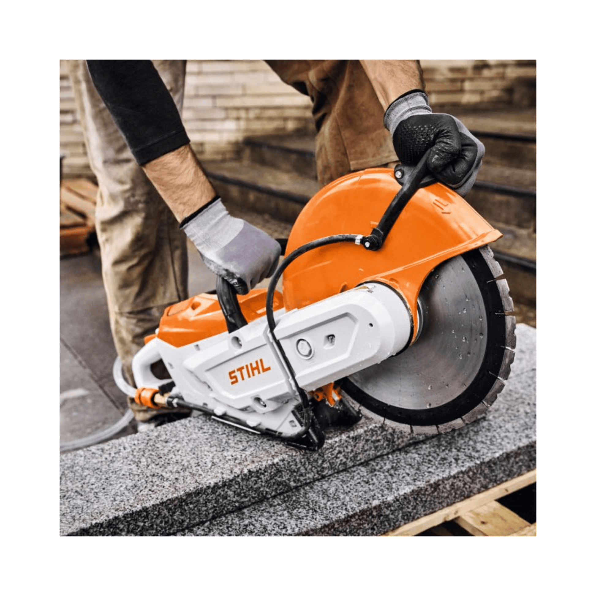 Operator using TSA 350 Cordless 14" Disc Cut-Off Machine to cut stone, showcasing its power and precision.