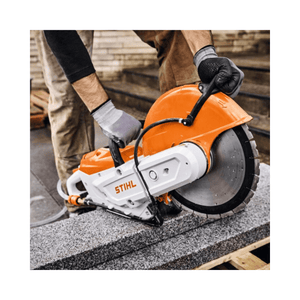 Operator using TSA 350 Cordless 14" Disc Cut-Off Machine to cut stone, showcasing its power and precision.