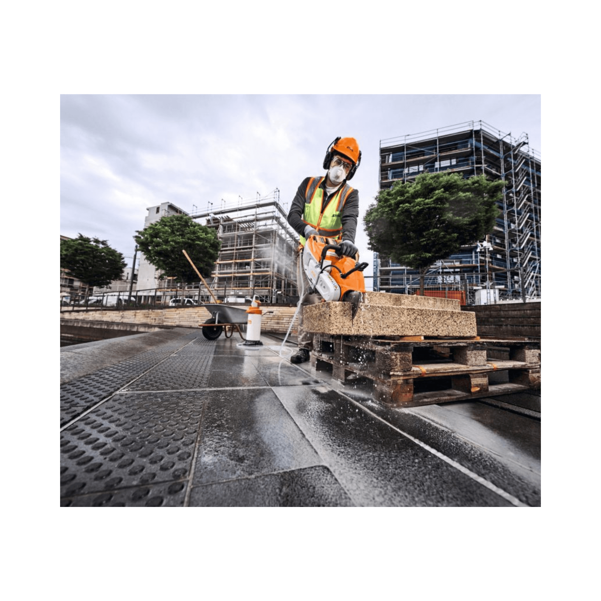 Professional using TSA 500 Cordless Disc Cut-Off Machine 14" on construction site for hardscaping.