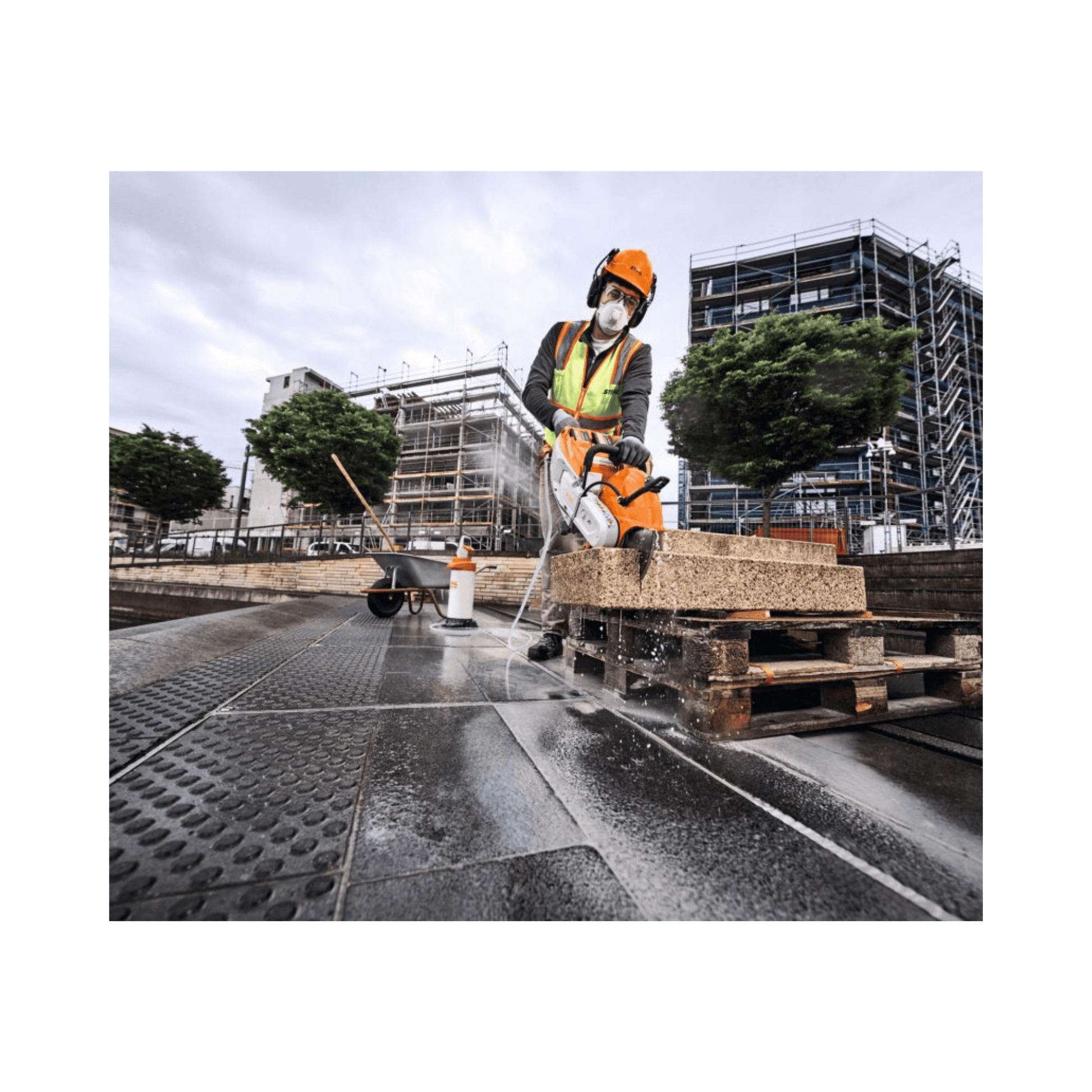 Professional using TSA 500 Cordless Disc Cut-Off Machine 14" on construction site for hardscaping.