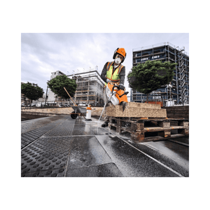 Professional using TSA 500 Cordless Disc Cut-Off Machine 14" on construction site for hardscaping.