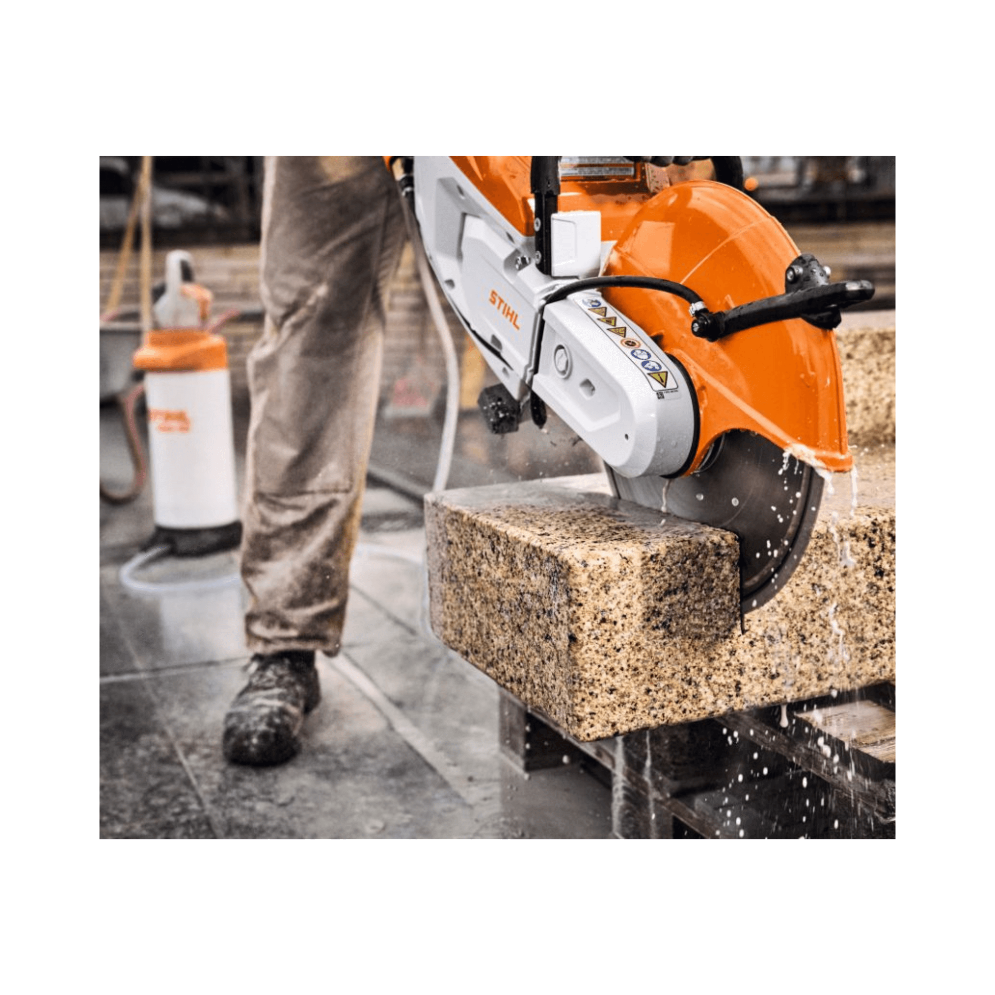 STIHL TSA 500 Cordless Disc Cut-Off Machine 14" cutting through a block with precision during construction work.