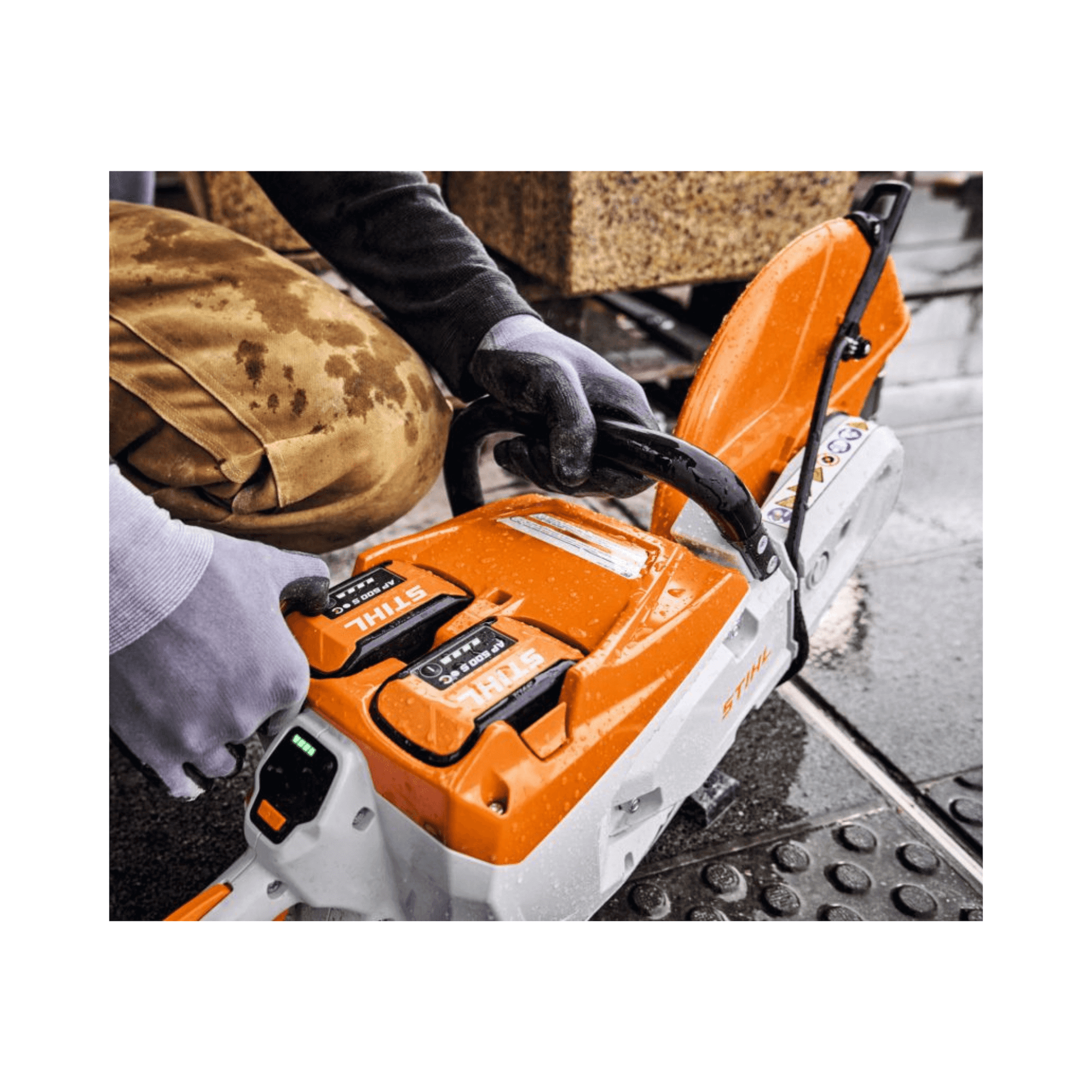 TSA 500 Cordless Disc Cut-Off Machine 14" being used by a tree surgeon outdoors.