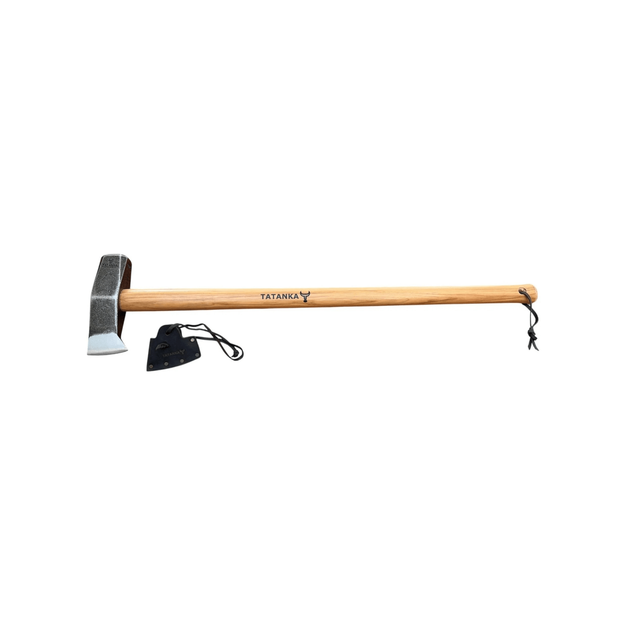 A wooden-handled axe with a steel head, shown horizontally on a plain white background. The handle is light brown wood with the brand name 'TATANKA' printed on it, and a small black sheath is placed beside the axe head.