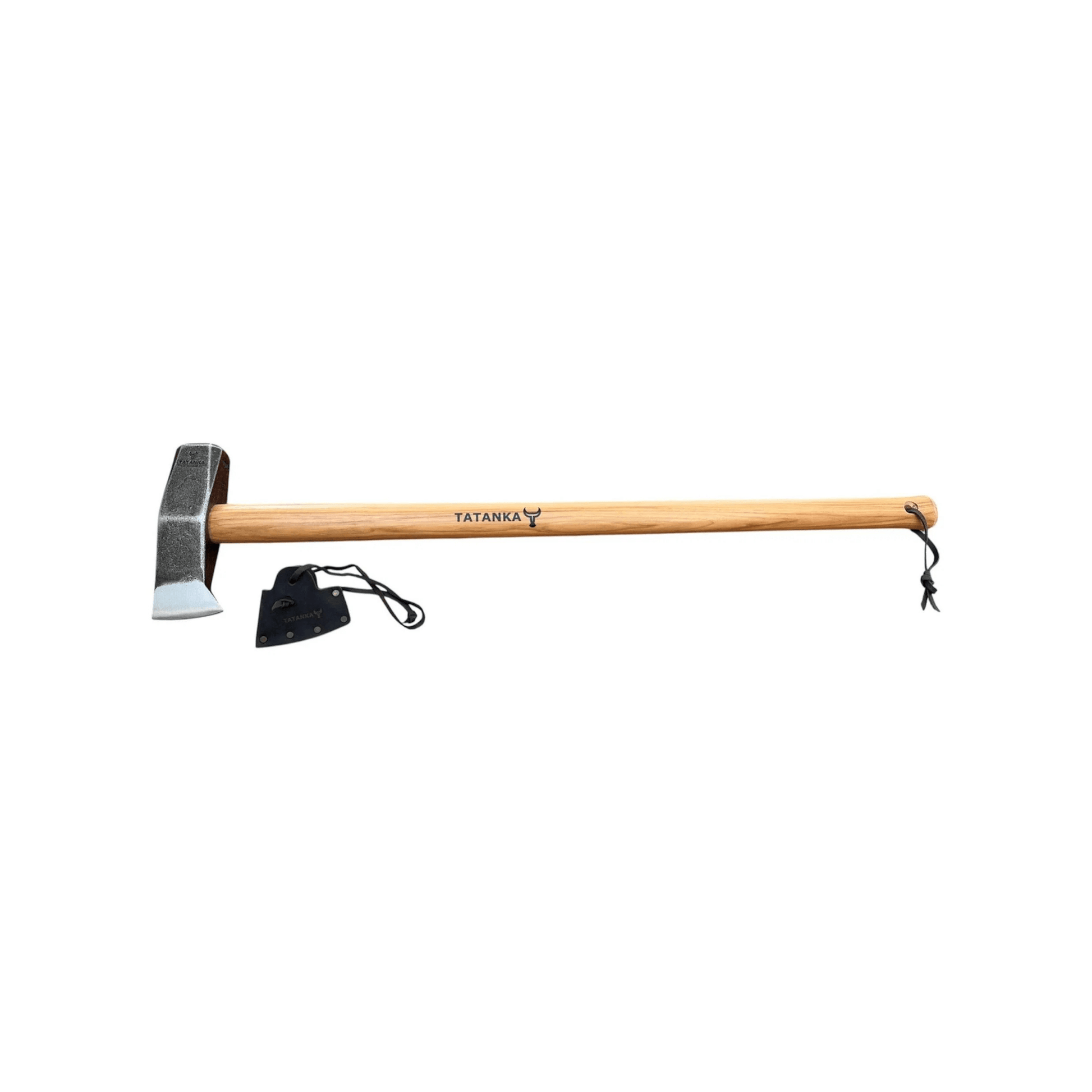 A wooden-handled axe with a steel head, shown horizontally on a plain white background. The handle is light brown wood with the brand name 'TATANKA' printed on it, and a small black sheath is placed beside the axe head.