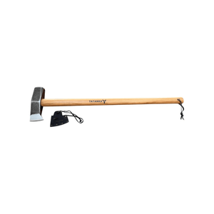 A wooden-handled axe with a steel head, shown horizontally on a plain white background. The handle is light brown wood with the brand name 'TATANKA' printed on it, and a small black sheath is placed beside the axe head.