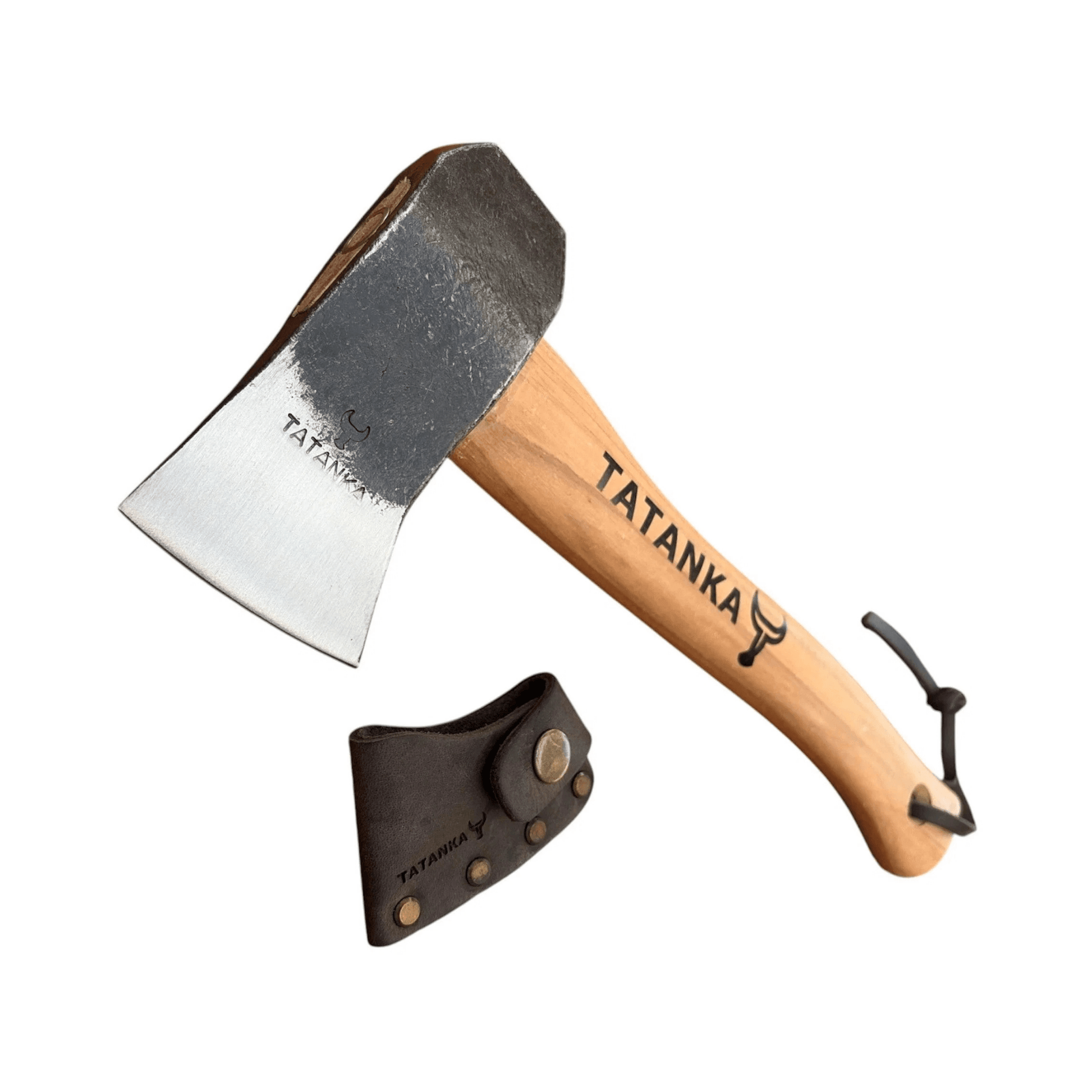 A hand axe with a natural wood handle and a dark steel head, shown alongside a black leather sheath. The handle and head are both printed with the brand name 'TATANKA'.