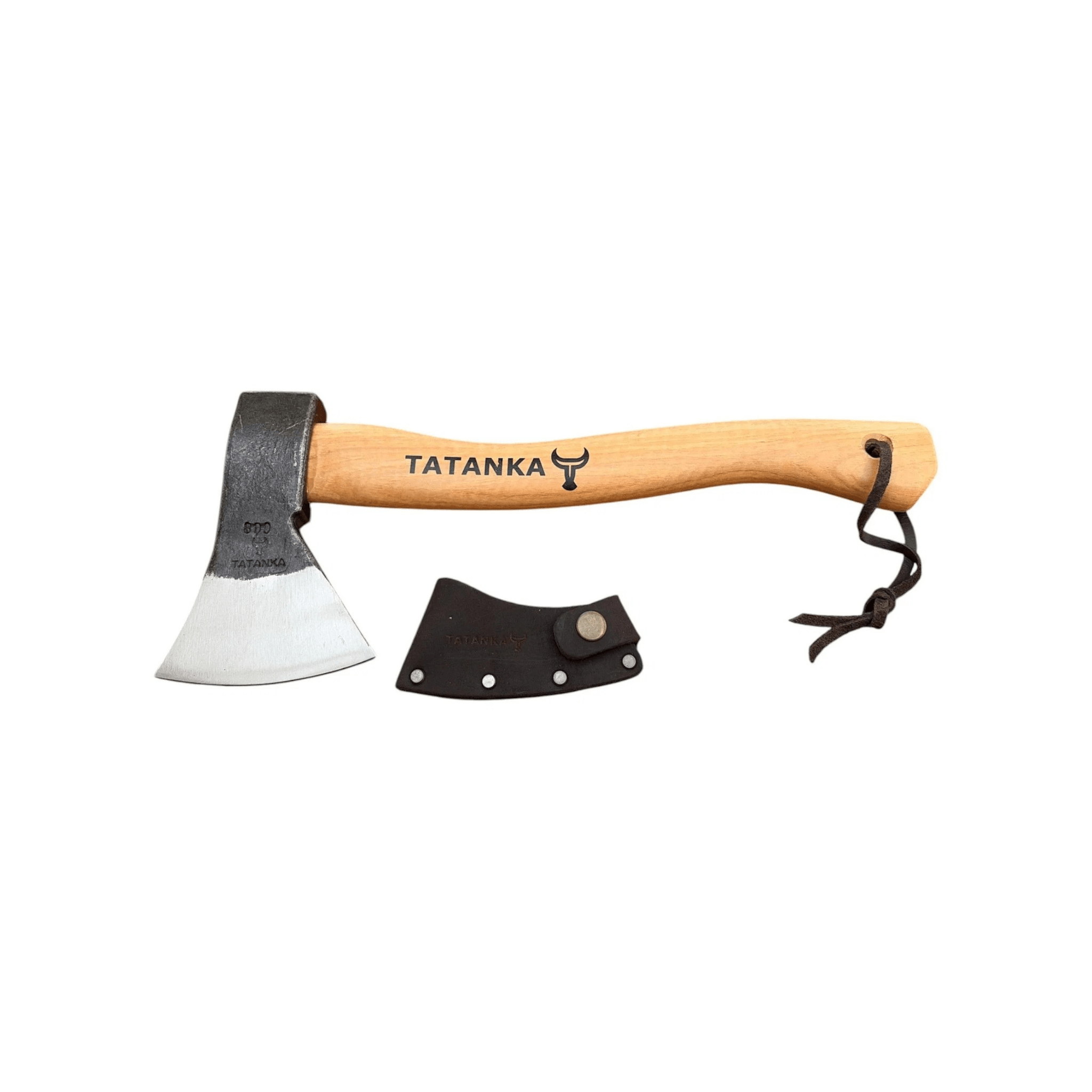 A hand axe with a light wood handle and a silver steel head, shown alongside a black leather sheath on a plain white background. The handle is printed with the brand name 'TATANKA' and a bull logo.
