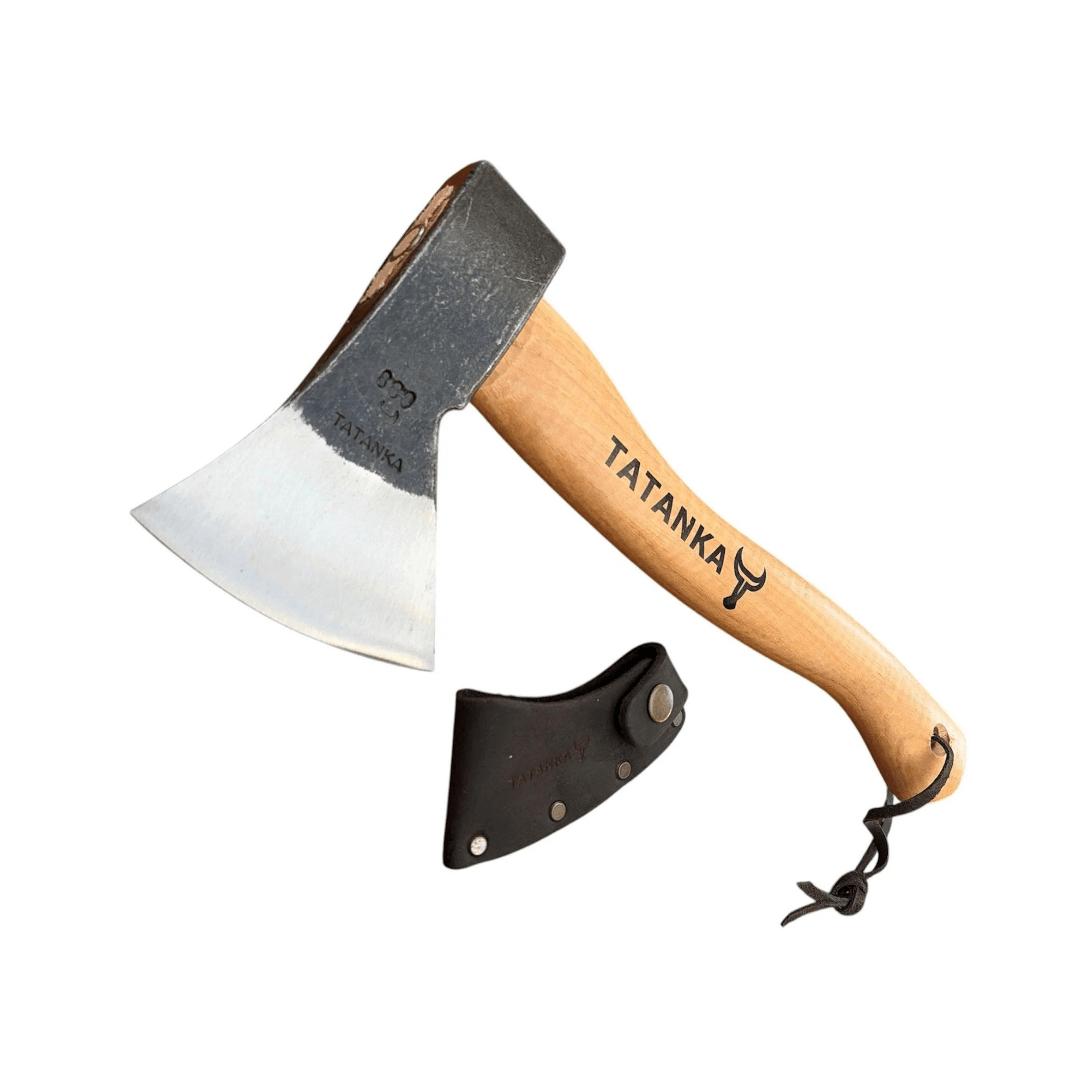 A hand axe with a light wood handle and a dark metal head, shown alongside a black leather sheath on a plain white background. The handle is printed with the brand name 'TATANKA'.
