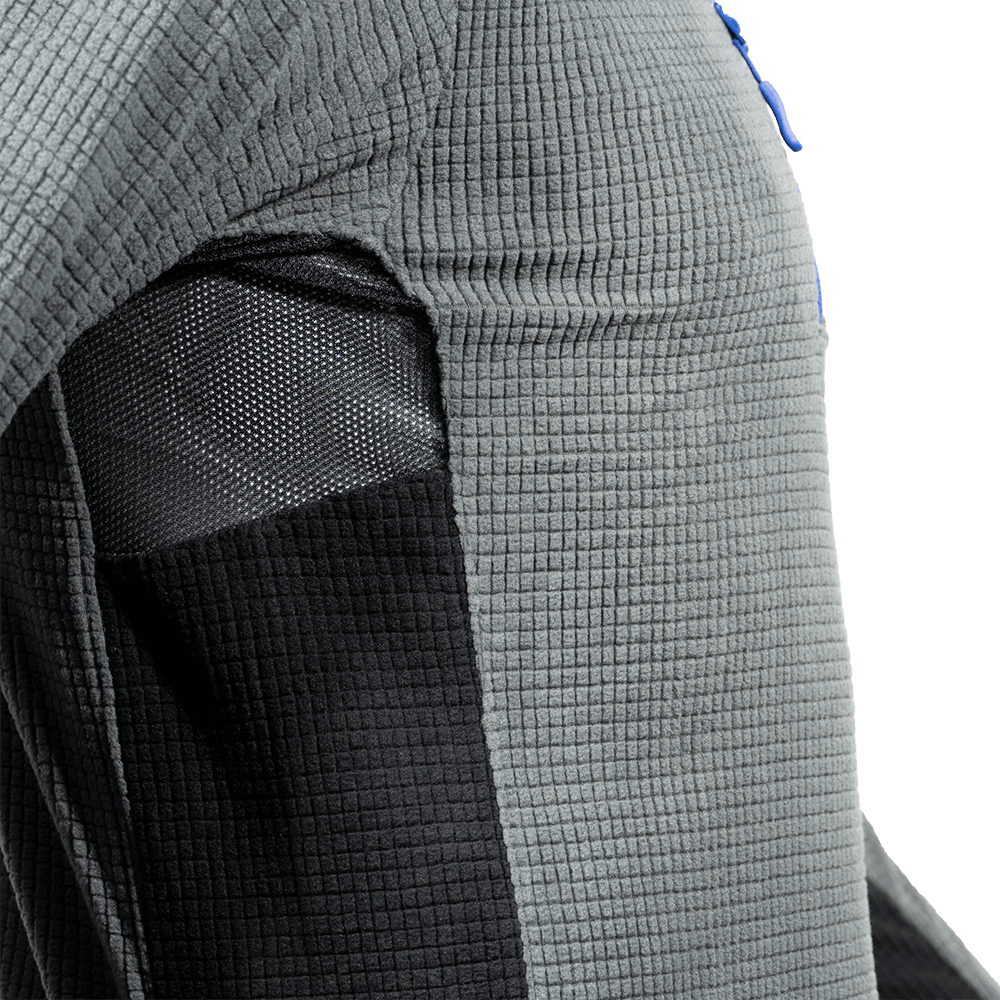 Close-up of Teufelberger Arctic Long Sleeve Fleece highlighting mesh underarm panel and textured fabric.