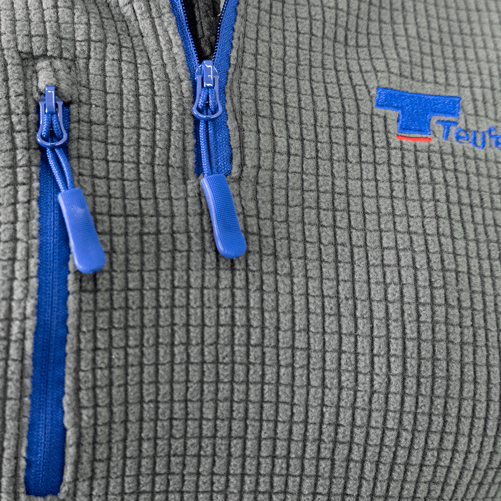 Close-up of Teufelberger Arctic Long Sleeve Fleece zipper and fabric detail, ideal for tree surgeons.