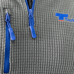 Close-up of Teufelberger Arctic Long Sleeve Fleece zipper and fabric detail, ideal for tree surgeons.