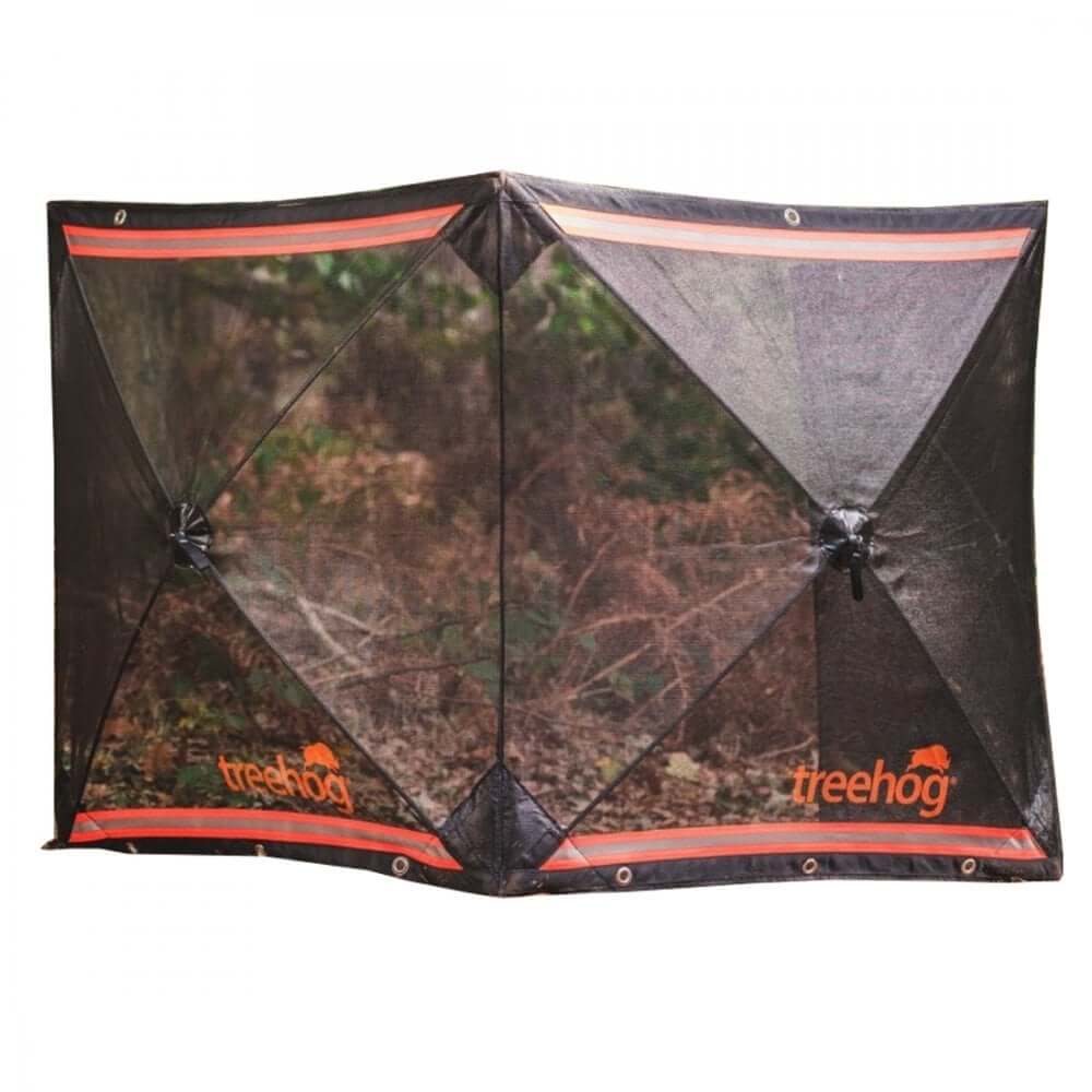 A black mesh stump grinding guard system with the TreeHog brand visible, designed to protect against flying debris during tree stump grinding.