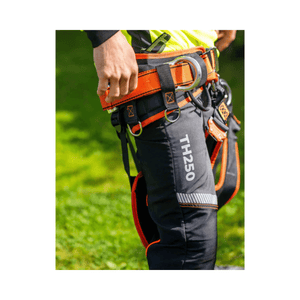 Close-up of TH250 Essential Class 1 chainsaw trousers showing safety features and straps for secure fit.