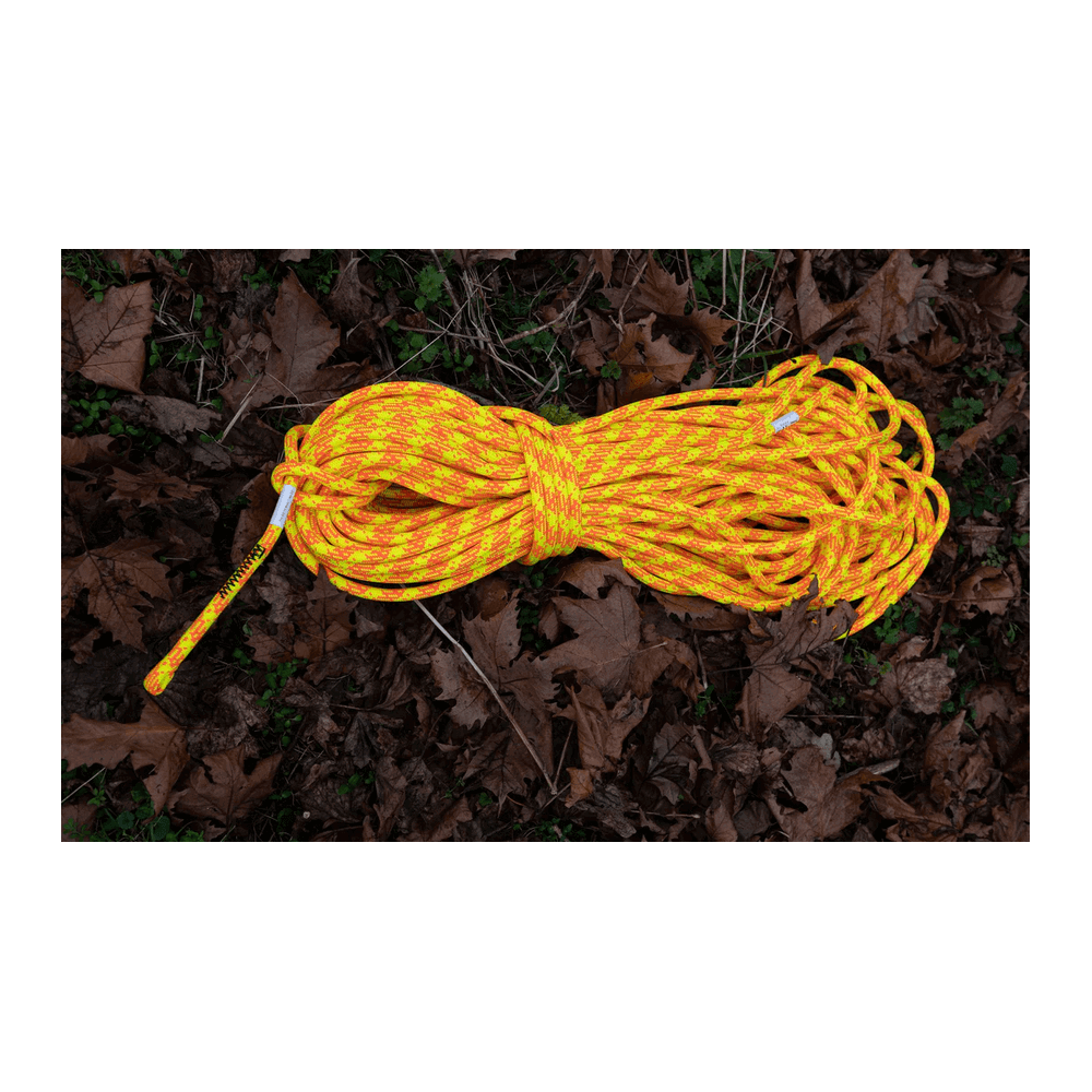 Nebula Yellow/Orange 11.8mm climbing rope ideal for tree surgeons, showcasing vibrant colors on a natural background.