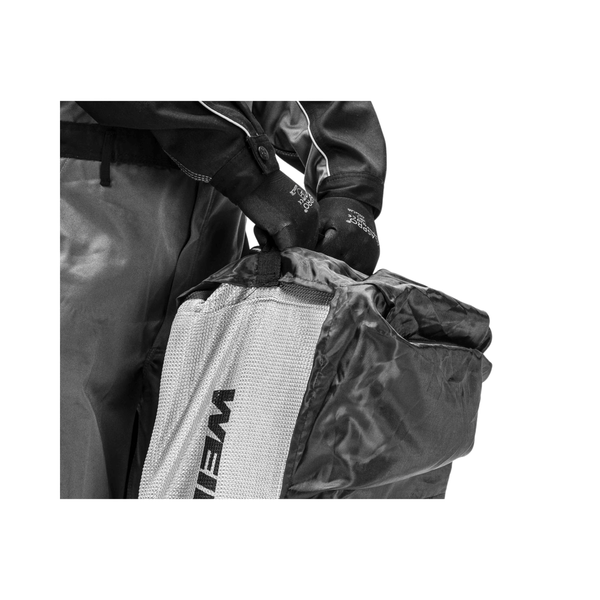 Close-up of hands wearing gloves handling a heavy-duty Weibang lawnmower bag for easy transport.