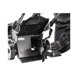 Close-up of a user inspecting the interior of the Weibang Virtue 50 SSD lawnmower's grass collector.