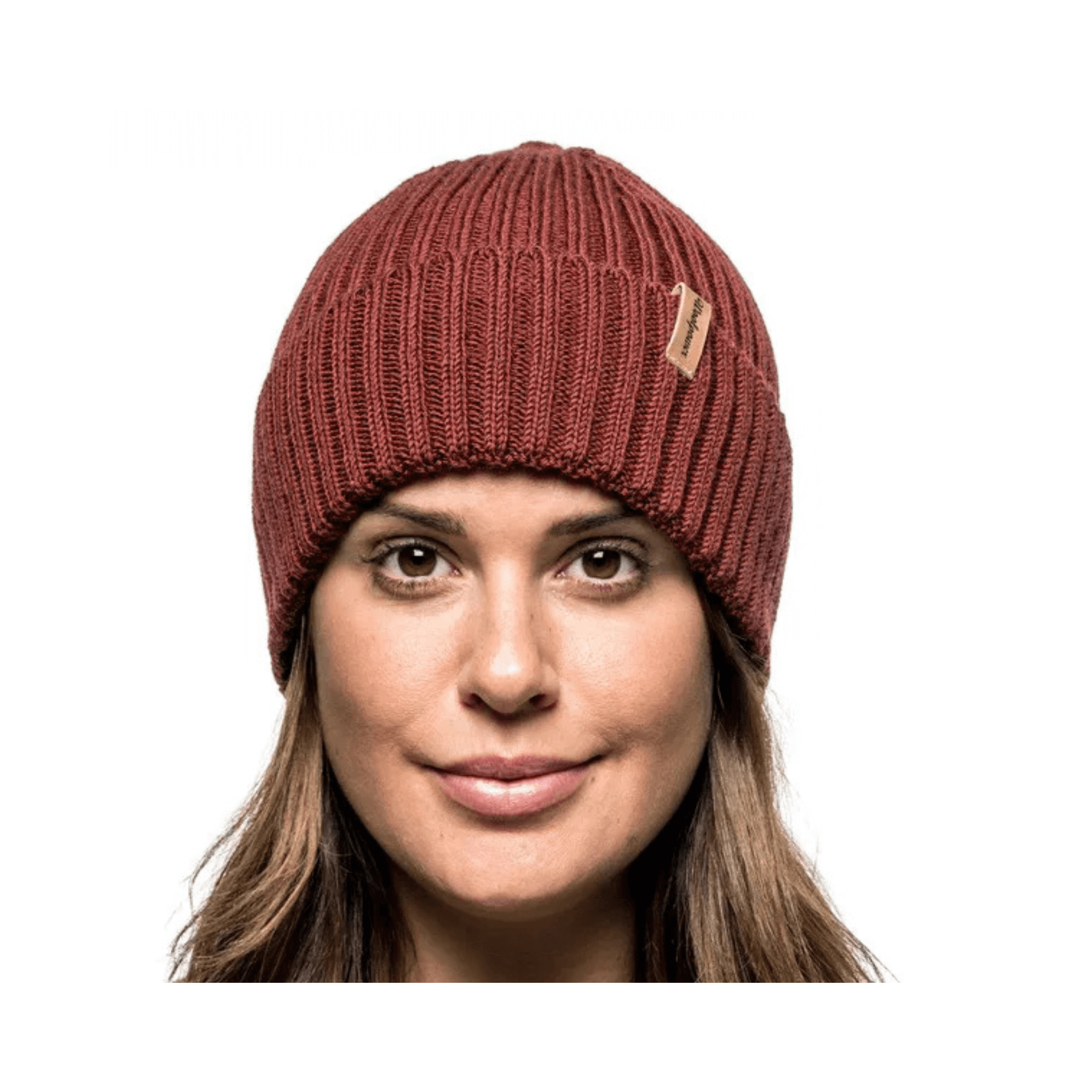 Beanie Ribbed - Woolpower Merino Wool Ribbed Beanie in a stylish maroon color, perfect for outdoor professionals.