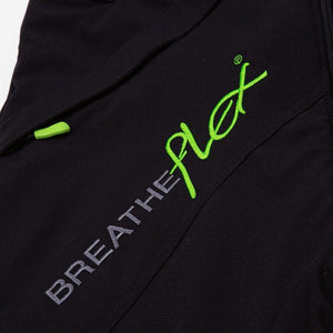 Close-up of Breatheflex logo on black chainsaw trousers, designed for tree surgeons with cut protection.