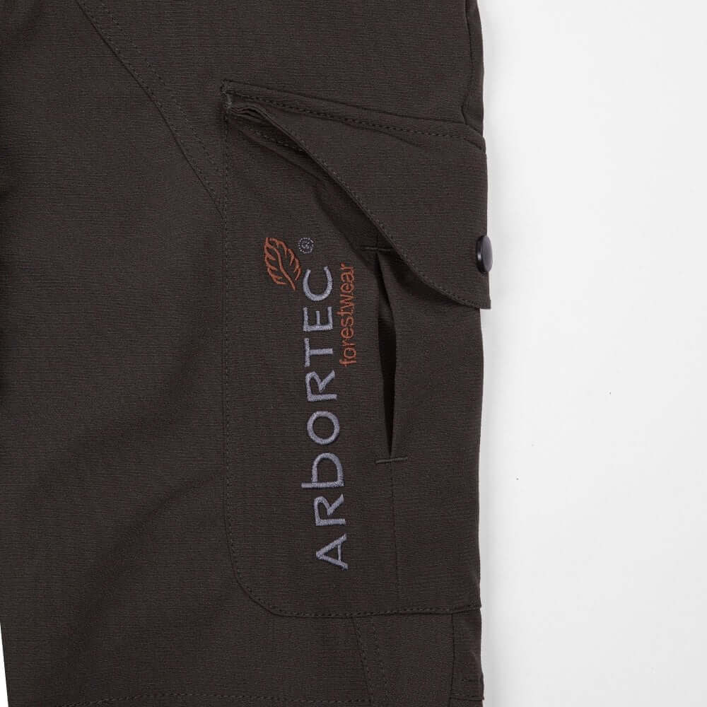 Detailed view of Arbortec Breatheflex Pro trousers featuring logo and pocket, designed for tree surgeons.