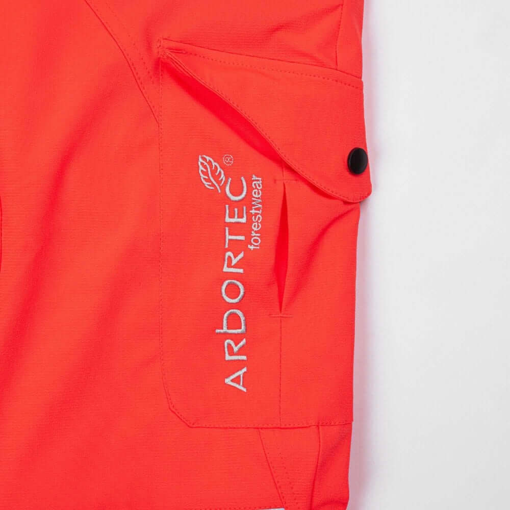 Arbortec Breatheflex Chainsaw Trousers in Hi Viz Orange with logo and pocket detail for tree surgeons.