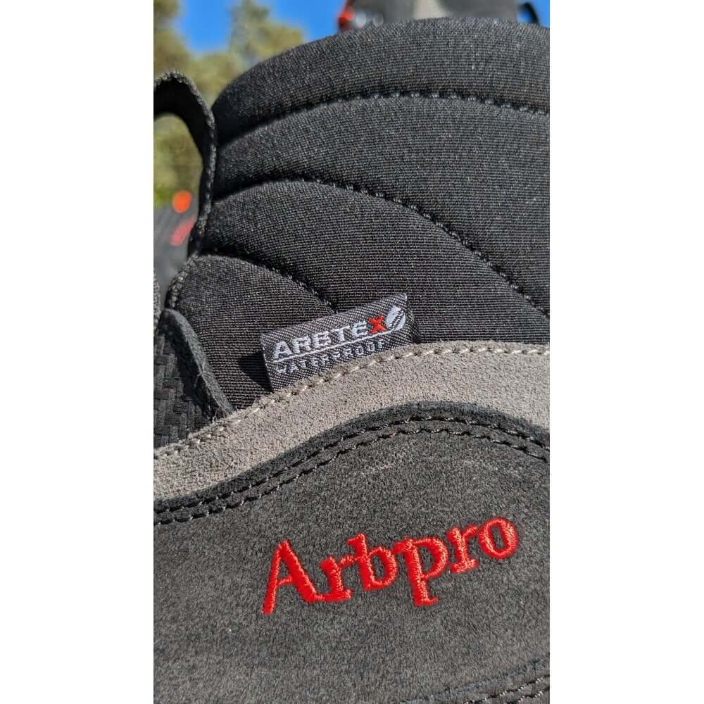 Close-up of Arbpro EVO Chainsaw Boots showing Arbtex waterproof tag and quality materials for tree surgeons.