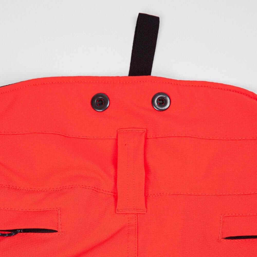 Close-up of buttons and waistband of Breatheflex Chainsaw Trousers in Hi Viz Orange for tree surgeons.