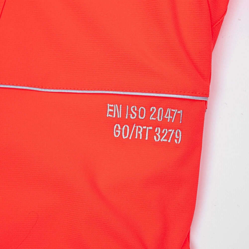 Close-up of the Arbortec Breatheflex Chainsaw Trousers showing EN ISO 20471 and GO/RT 3279 labels in Hi-Vis Orange.