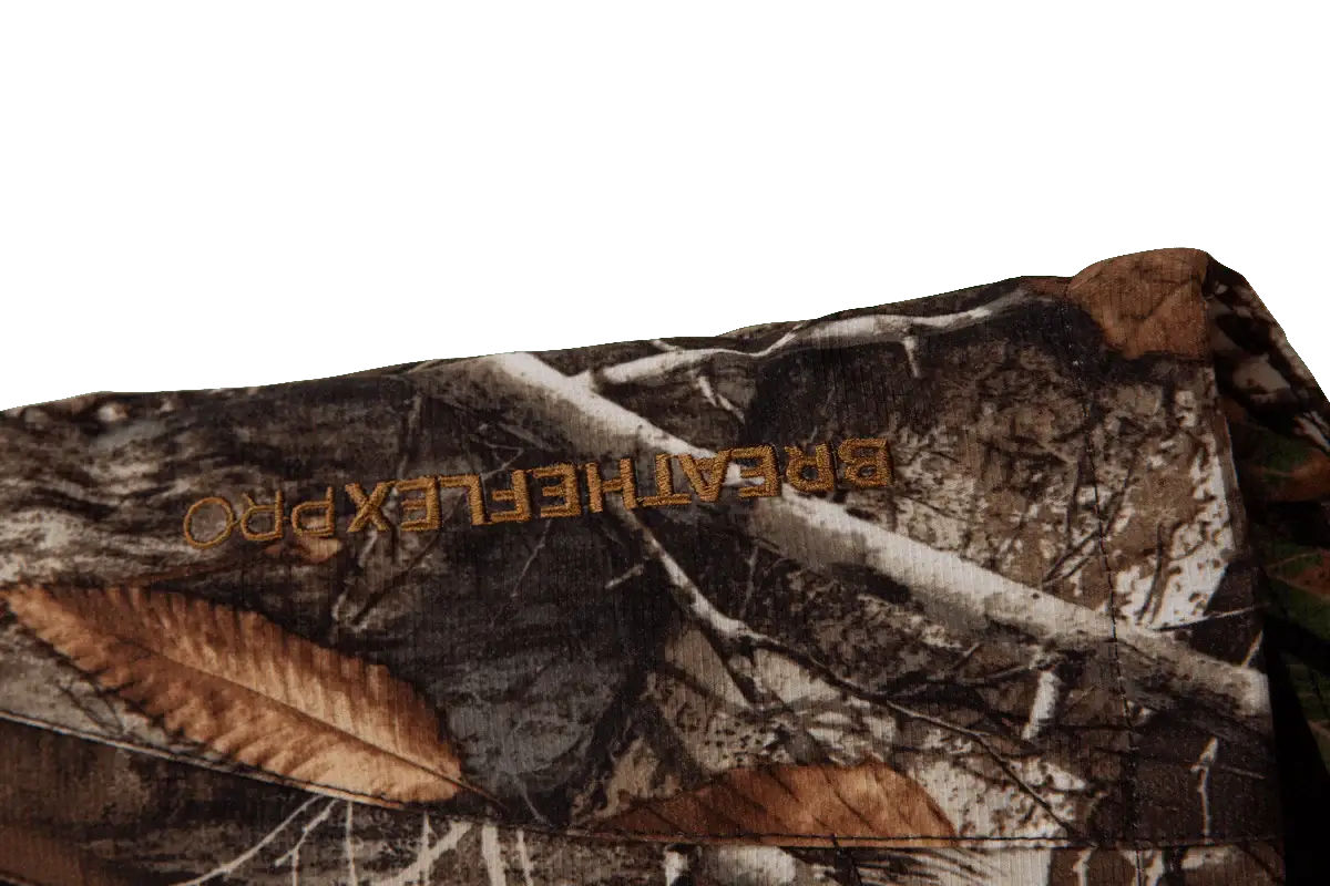 Close-up of Breatheflex Pro Realtree Brown Work Jacket showcasing camouflage design and branding details.