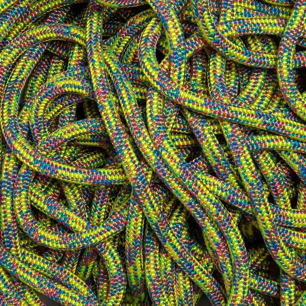Colorful ropes used by tree surgeons for climbing and safety equipment in tree maintenance.