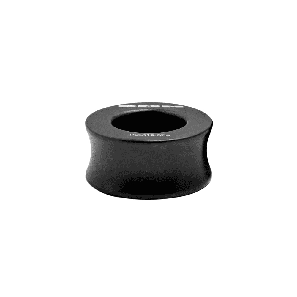 DMM Pinto Pulley Spacer in matte grey, designed for tree surgeons to enhance pulley performance during climbing and rigging.