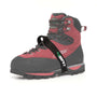 A black foot ascender device attached to a red and black climbing boot.