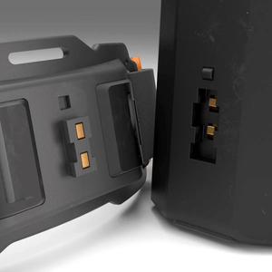 Close-up of FreeLight 3000 headlamp modular battery connector, showcasing the innovative design and secure fit.