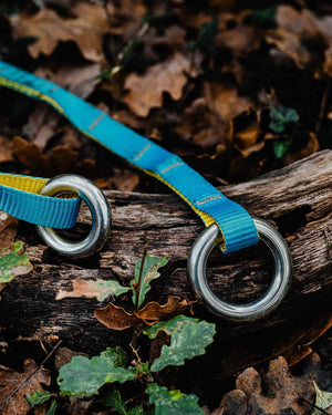 Close-up of Joker Light Cambium Saver with durable rings, set on leaves and wood, ideal for tree surgeons and aerial rescue.