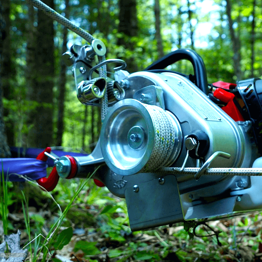 PCW4500 petrol pulling winch with cable in forest, designed for tree surgeon heavy lifting tasks