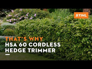 HSA 60 cordless hedge trimmer cutting through lush hedges, perfect for tree surgeons seeking precision and convenience.
